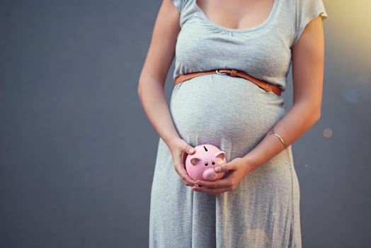 Pregnant woman, piggy bank and savings for newborn, baby and family investment or money, budget and planning for future finance. Pregnancy, mother and investing cash on studio gray background.