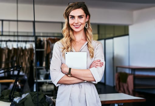 Im not interested in doing anything else but fashion designing. Portrait of a young fashion designer standing in her workshop