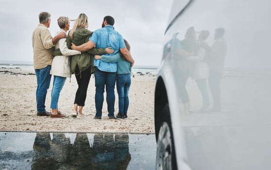 Travel, love and big family hug at ocean for bonding experience on road trip in Australia. Adventure, beach and drive for holiday break sightseeing with parents, grandparents and child