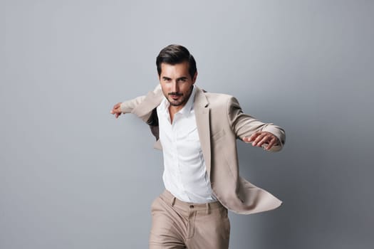 man hand fashion beige model happy flying standing arm running confident businessman beard person suit victory adult professional smile winner business