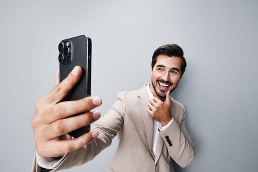 man connection portrait business phone smartphone studio happy call mobile smile handsome lifestyle cell hold trading internet suit holding application phone mobile