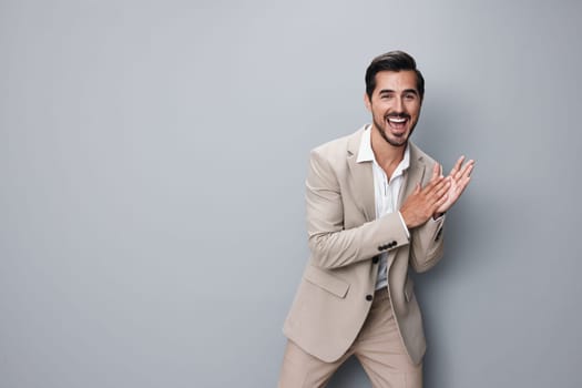 portrait man standing success suit professional male tie copyspace guy job young smiling beige shirt business businessman happy executive confident handsome