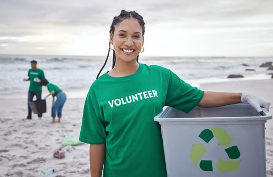 Cleaning, recycle and portrait of black woman at beach for plastic, environment or earth day. Recycling, sustainability and climate change with volunteer and trash for pollution and eco friendly.