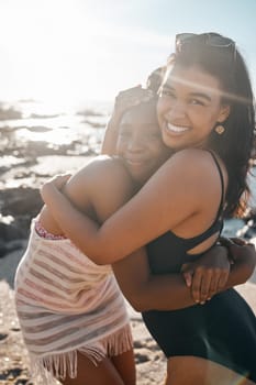 Women, portrait or friends embrace by beach, sea or ocean in summer holiday bonding, support vacation or girls travel location. Smile, happy or black people in hug, social gathering or relax nature.