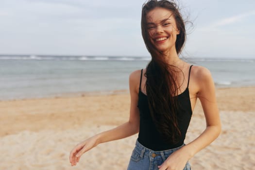 sunset woman ocean holiday beach vacation sand happiness tropical carefree caucasian summer outdoor sea walk smiling relax girl smile freedom lifestyle