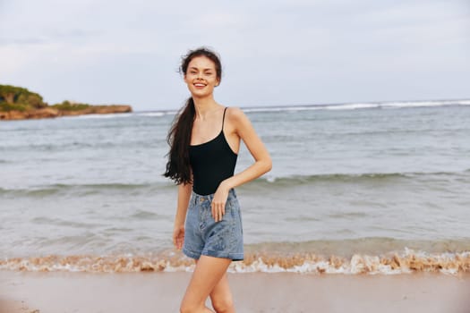 enjoyment woman ocean sea sunset freedom walk dress running travel coast vacation person lifestyle nature summer sky beach sand beautiful smile