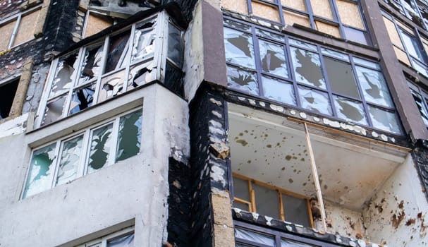 Residential buildings, windows and balconies were damaged by the blast and shrapnel from artillery shelling. The destruction of the city by military operations, the consequences of the war