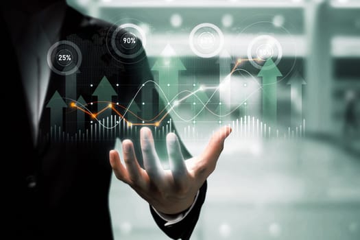 Businessman analyst working with digital finance business data graph showing technology of investment strategy for perceptive financial business decision. Digital economic analysis technology concept.