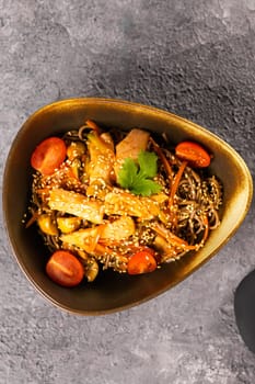 Udon stir-fry noodles with chicken and vegetables. Asian cuisine