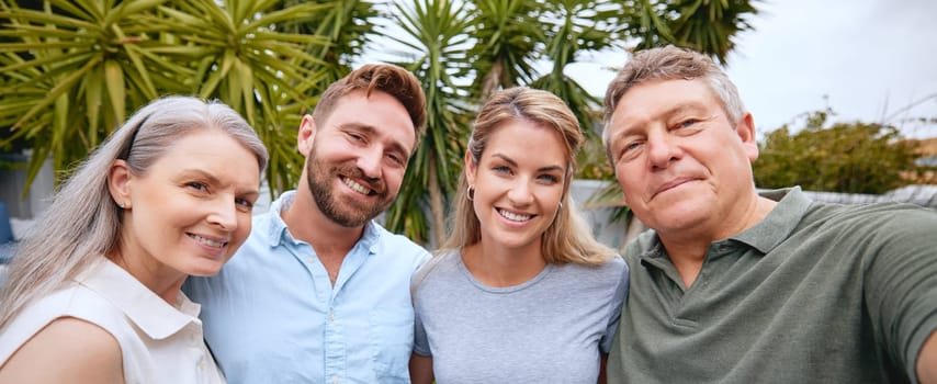 Selfie and portrait of family in a garden with love, hug and peace together. Happy, smile and relax mother and father with adult children, photo and relax on holiday in nature of Turkey.