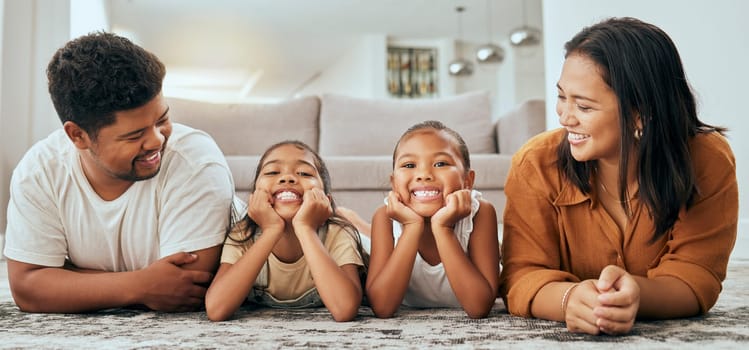 Love, happy family and lying relax on floor together in living room at home, bonding spend quality time and freedom. Carefree, loving parents laughing and young children smile, laugh and relaxing.