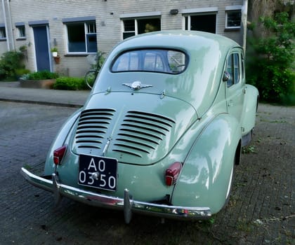 Amersfoort, the Netherlands May 21 2023 The back of a light blue very old Renault 4CV that is parked. This kind of car was produced between 1947 and 1961 