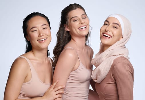 Face, beauty skincare and group of women in studio isolated on gray background. Diversity, cosmetics and portrait of girls, friends or female models in makeup with healthy skin after facial treatment.