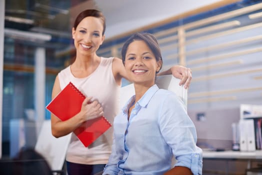 Ready to get to work. Portrait of two female design professionals in the office