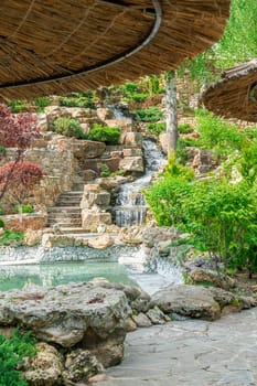 courtyard with waterfall and swimming pool in the hotel. photo