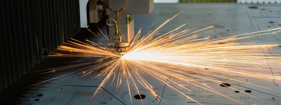 CNC machine. Laser cutting of metal. Sparks