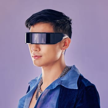 Cyberpunk, fashion and futuristic asian man, jewellery and clothes with cool glasses in purple mockup studio background. Aesthetic, abstract and designer sunglasses on male model with sci fi style.