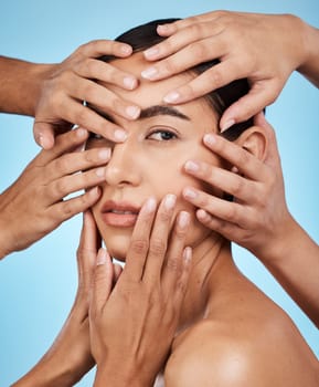 Many hands, touch face and woman in portrait for skincare wellness, cosmetics and care by blue background. Studio, skin health model and facial aesthetic with transformation, natural glow or makeup.