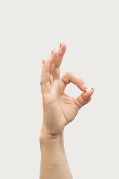 gesture of a woman's hand on a white background isolate. photo