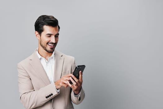 man smartphone smile phone studio communication call portrait selfies suit entrepreneur trading beard lifestyle technology hold male business happy blogger connection
