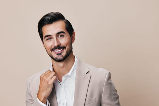 suit man studio copyspace job smile handsome male happy grey successful portrait shirt businessman beard professional business beige executive arm smiling