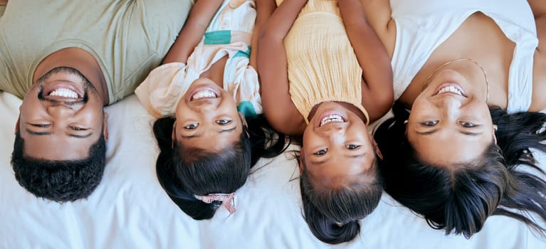 Family, happiness and bedroom playing of mother, father and girl face at home. Portrait of happy parents and children smile in a parent of kid room feeling love, fun and care in a house on a morning.