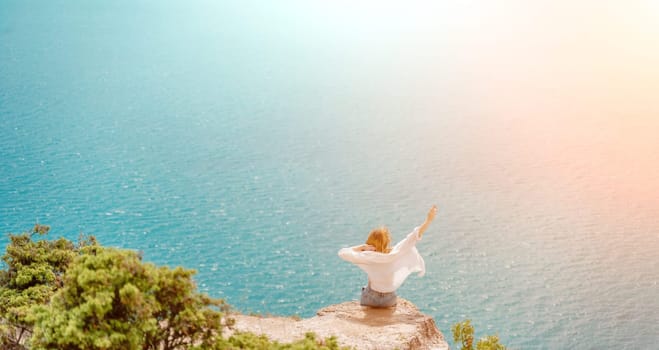 Woman travel summer sea. Portrait of a happy woman on a background of beautiful sea. Rear view of a woman in a white shirt. Freedom and happiness.