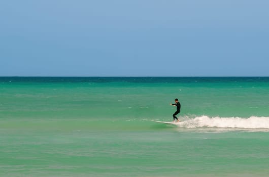 Surfing on a water board. Surfer ride the waves on the sea. Netanya, Israel. May 23, 2023.