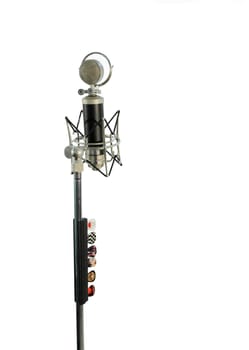 Vocal condenser microphone with wind screen isolated on white background.
