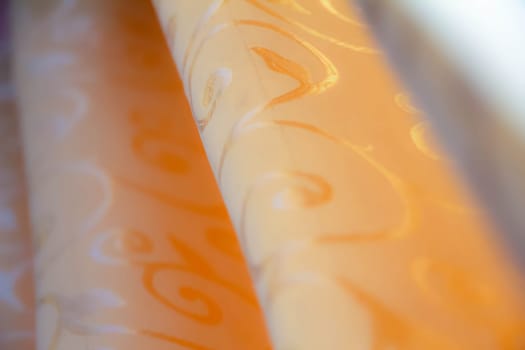 Closeup of orange fabric pattern printed with roundness shapes.