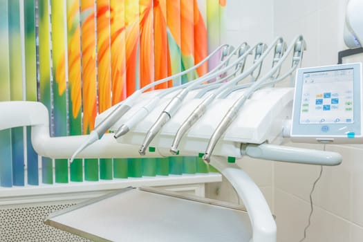 Dental tools on a dentist's chair.Dental drills and instruments