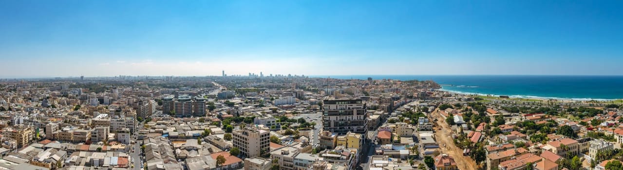 Panorama aerial view of south Tel Aviv neighborhoods and Old Jaffa. A combination of new and old construction. Recognized places such as the Etzel Museum, Old Jaffa Port, Tel Aviv promenade and Neve Tzedek neighborhood.