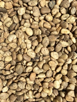 brown pebble rock stone on ground texture background. abstract background no people.