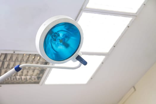 Lamp inside operating room in a hospital. Close up view with copy space.
