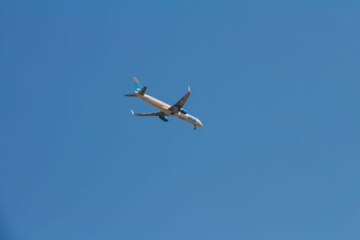 Tel aviv, Israel - October 7, 2017: Arkia airline commercial plane flying in the blue sky going for a landing. Arkia is an Israeli airline.