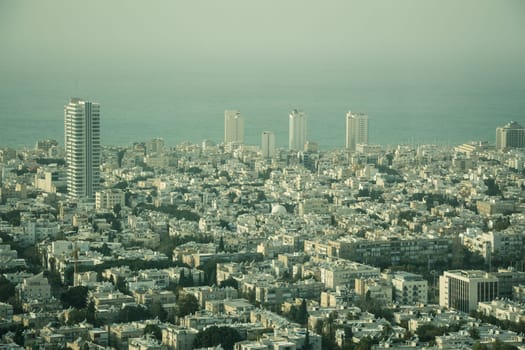Aerial view of the City of Tel Aviv, Israel on hazy day.
The Mediterranean Sea in the background.
