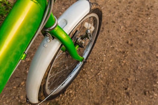 Bicycle ride through muddy dirt road.