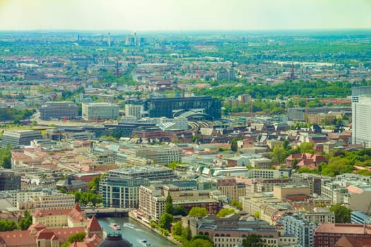 Aerial view of Berlin skyline with colorful buildings.