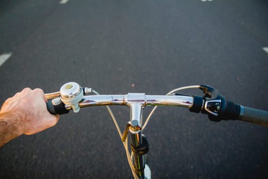 Riding a bike on the road. Original point of view (POV).