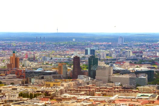 Aerial view of Berlin skyline with colorful buildings.