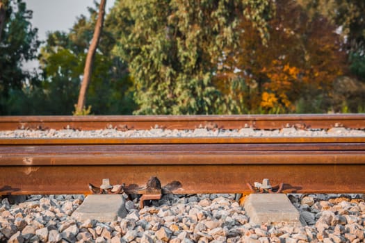 Railroad track in a rural area in the afternoon.