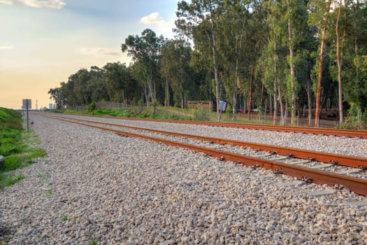 Railroad track in a rural area in the afternoon.