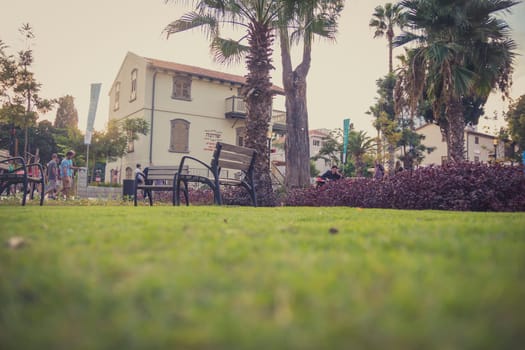 Tel Aviv, Israel - Aug 21, 2015: Sarona open air commercial center in Tel Aviv with visitors and the visitors center building .It's a renewed Templar settlement, turn into leisure and shopping complex.