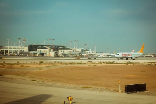 Tel Aviv, Israel - Sep 15, 2015: Flypgs airline commercial plane on the runway and terminal 3 at Ben Gurion International Airport.