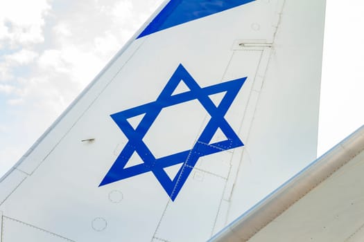 Tailplane of an airplane with a drawing of the Israeli flag.