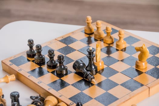 wood chess pieces on board game. brown vintage background