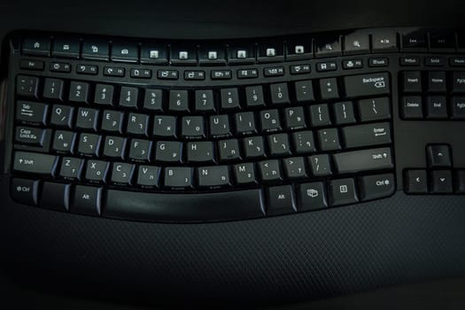 Keyboard with letters in Hebrew and English - Wireless keyboard - Top View -  Dark atmosphere