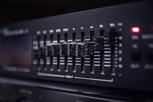 Graphic equalizer controls on an audio system - Close Up Selective Focus
