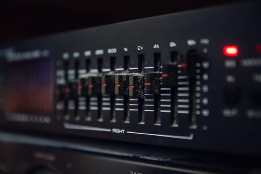 Graphic equalizer controls on an audio system - Close Up Selective Focus
