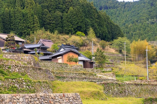 Houses in small farming community atop stone terrace walls in mountains. High quality photo
